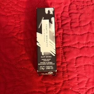 Fenty Beauty Slip Shine Sheer Lipstick in Black Packaging